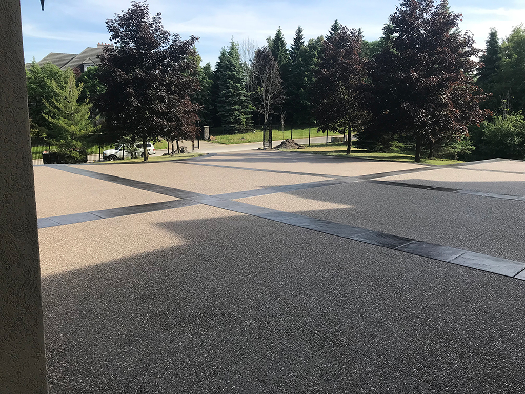 Exposed aggregate and stamped concrete courtyard Stouffville