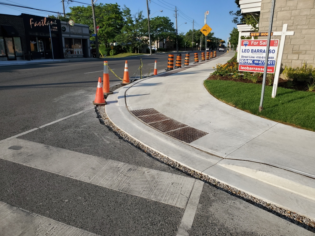 Accessible concrete sidewalks and curb construction